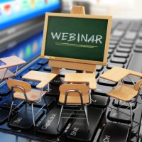 Webinar concept. Schooldesk and chalkboard on the laptop keyboard. 3d Webinar concept. Schooldesk and chalkboard on the laptop keyboard. 3d